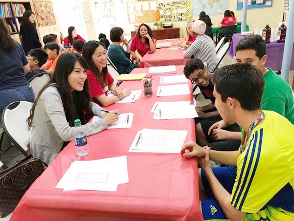 Bank associates provide group and one-on-one financial consultations to residents of low income housing community